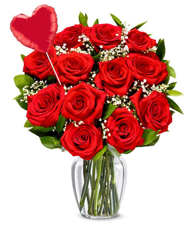One dozen red roses with a heart balloon