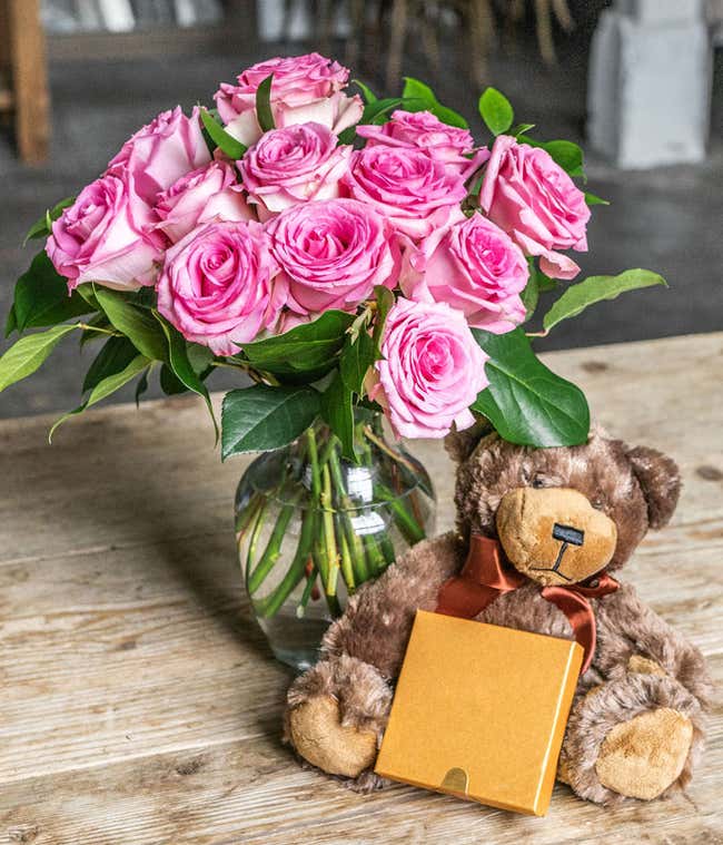 One Dozen Pink Roses with a Clear Glass Vase, Chocolates, &amp; Teddy Bear