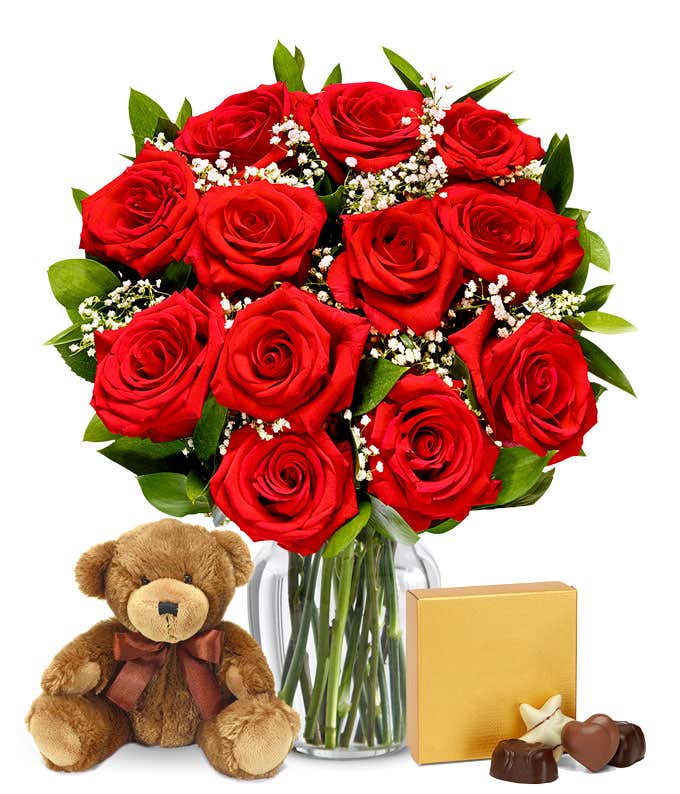 A romantic gift set featuring long stem red roses, a box of chocolates, and a plush teddy bear. This perfect combination offers a heartfelt and memorable display for any special occasion.