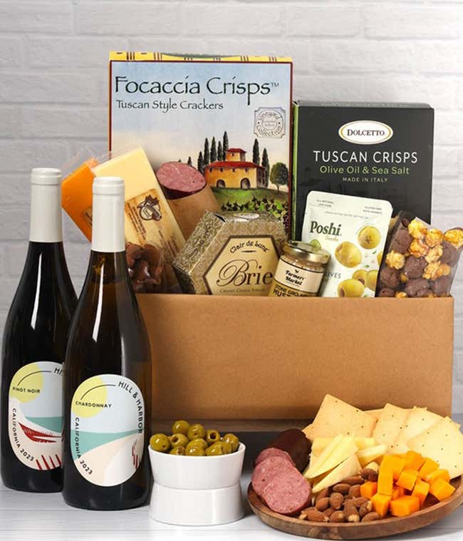 An abundant gift box filled with two bottles of California wine - red &amp; white, assorted crackers, three cheeses, summer sausage, and snacks to make an amazing charcuterie spread. 