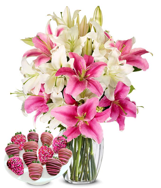 A bouquet featuring pink lilies and white lilies, with an optional glass vase and Chocolate Covered Strawberries