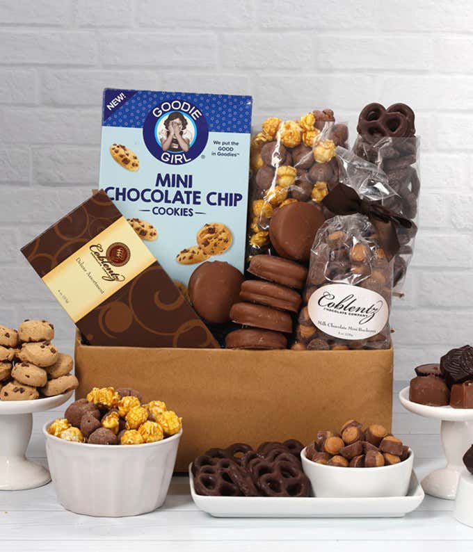 A gift set overflowing with chocolate indulgences including chocolate-covered pretzels, mini cookies, caramel popcorn, chocolate and peanut butter buckeyes, six chocolate-covered Oreos, and a box of assorted truffles for a luxurious touch.