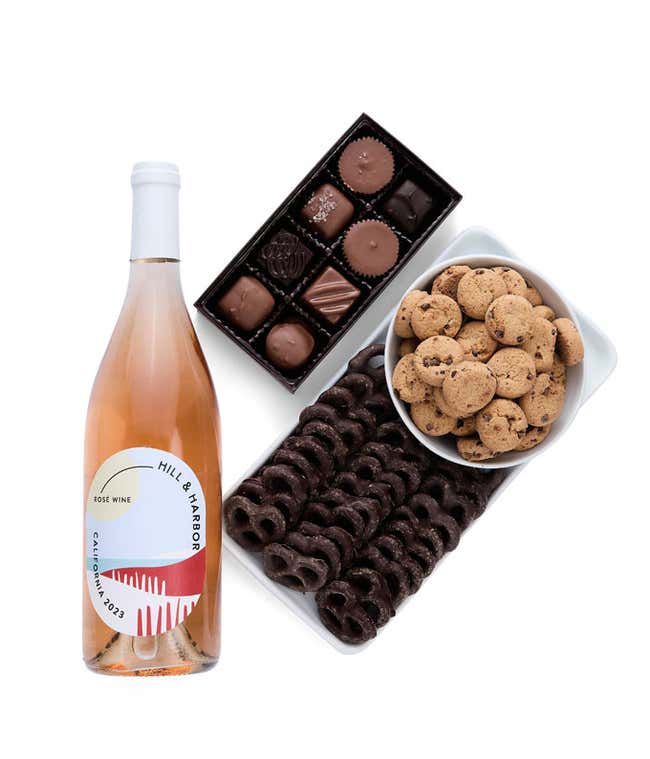a gift box full of decadent treats.  Contents include: a bottle of California Ros&eacute; wine, a bag of milk chocolate pretzel, a box of mini chocolate chip cookies, and a 4-ounce box of assorted chocolates.