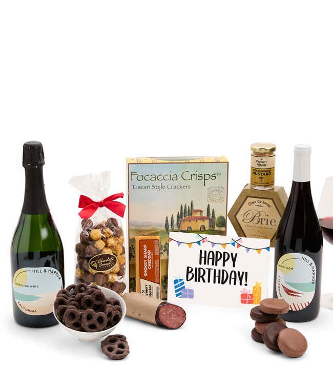 A gift set featuring 2 bottles of Hill &amp; Harbor wine - red and sparkling, focaccia crisps, two cheeses, mustard, summer sausage, caramel popcorn, chocolate pretzels, six chocolate-covered Oreos and a Birthday card to complete the gourmet experience.