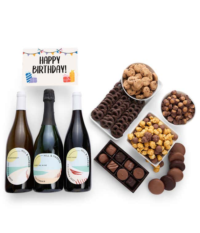 A gift set with 3 bottles of wine - red, white and sparkling, paired with chocolate pretzels, caramel popcorn, mini cookies, chocolate peanut butter buckeyes, six chocolate-covered Oreos, assorted chocolates, and a celebratory Birthday card.