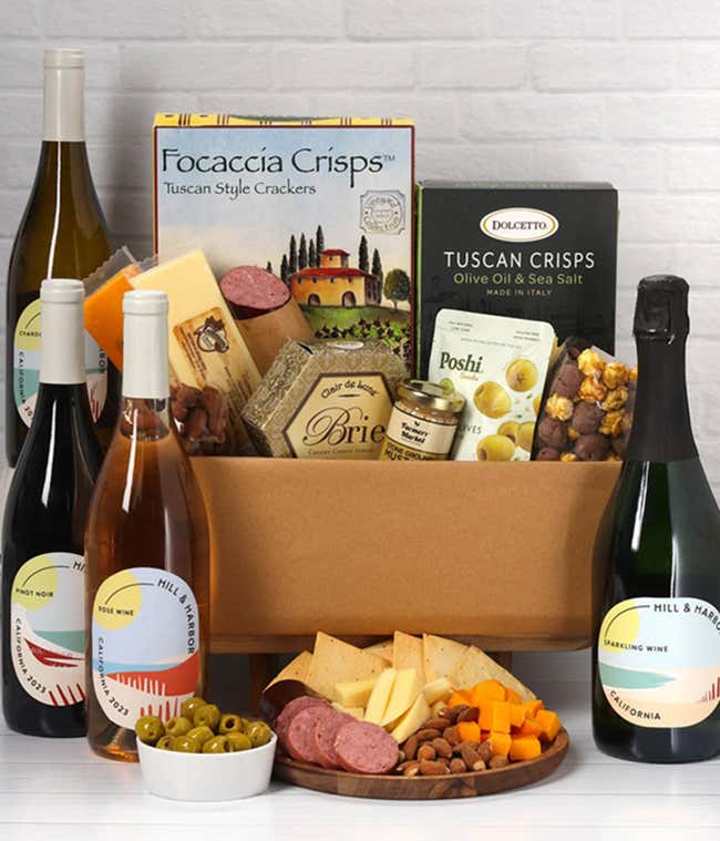 A wine and cheese gift set featuring 4 bottles of Hill &amp; Harbor - Sparkling wine, Ros&eacute; wine, Chardonnay, and Pinot Noir. Includes a variety of cheeses, crackers, olives, smoked almonds, summer sausage, and condiments.