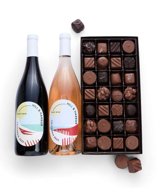 A gift box containing two bottles of California Wine - Pinot Noir & Rosé wine and a 1 lb box of 28 assorted gourmet chocolates for a perfect pairing